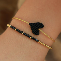 Gold bracelet facet black